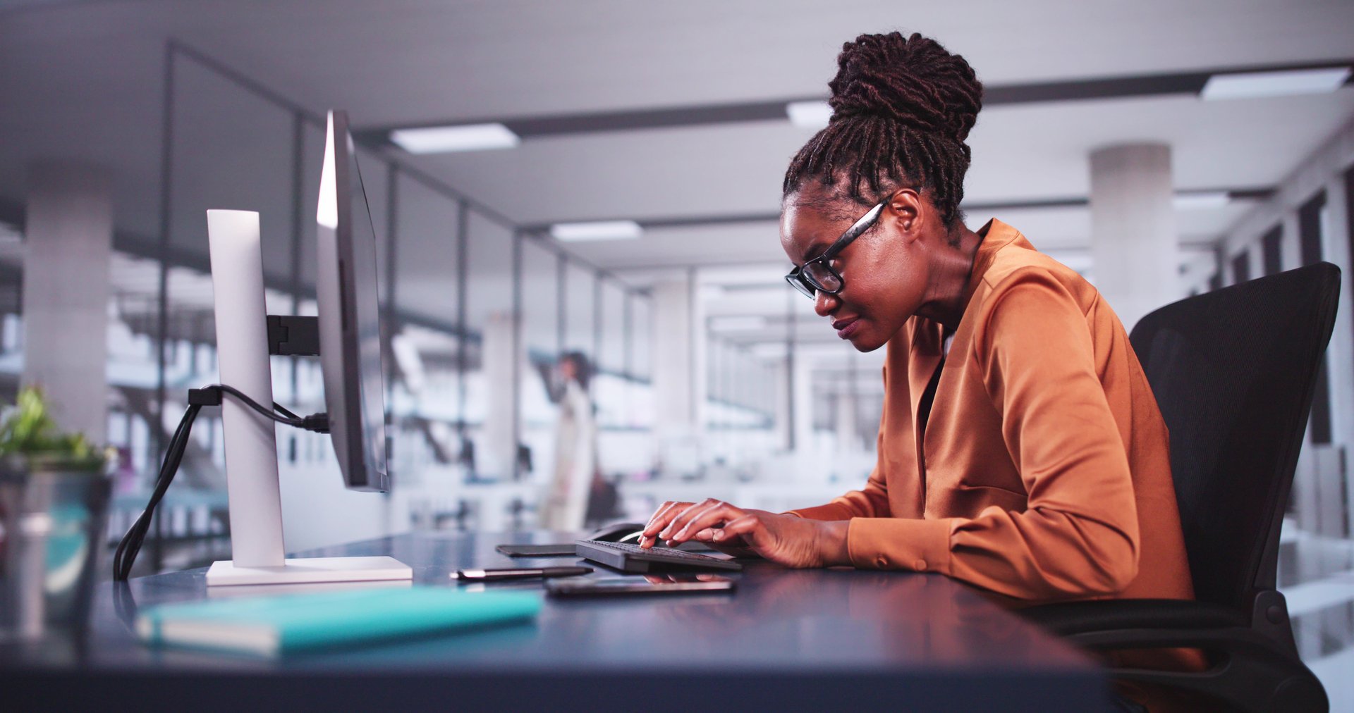 Bad Posture Sitting In Office Chair At Computer Desk